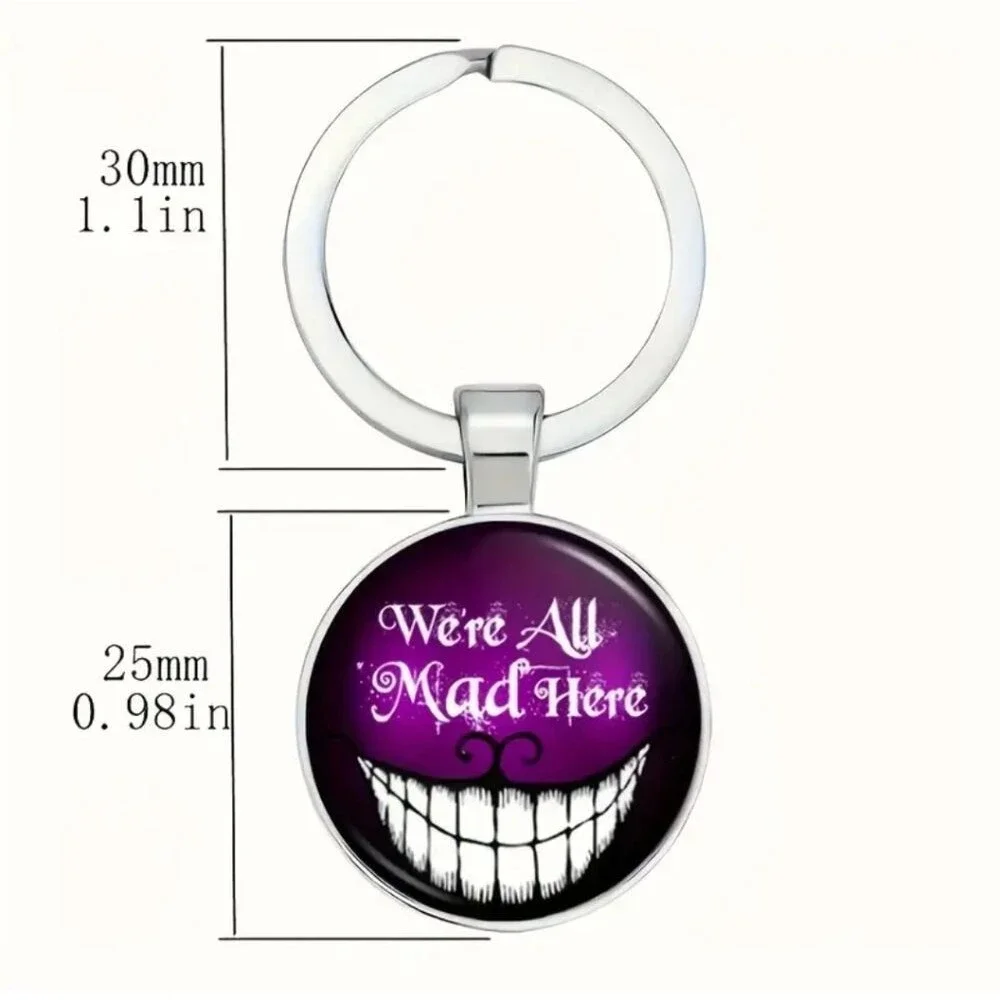 Cheshire cat we are all mad glow in the dark keychain